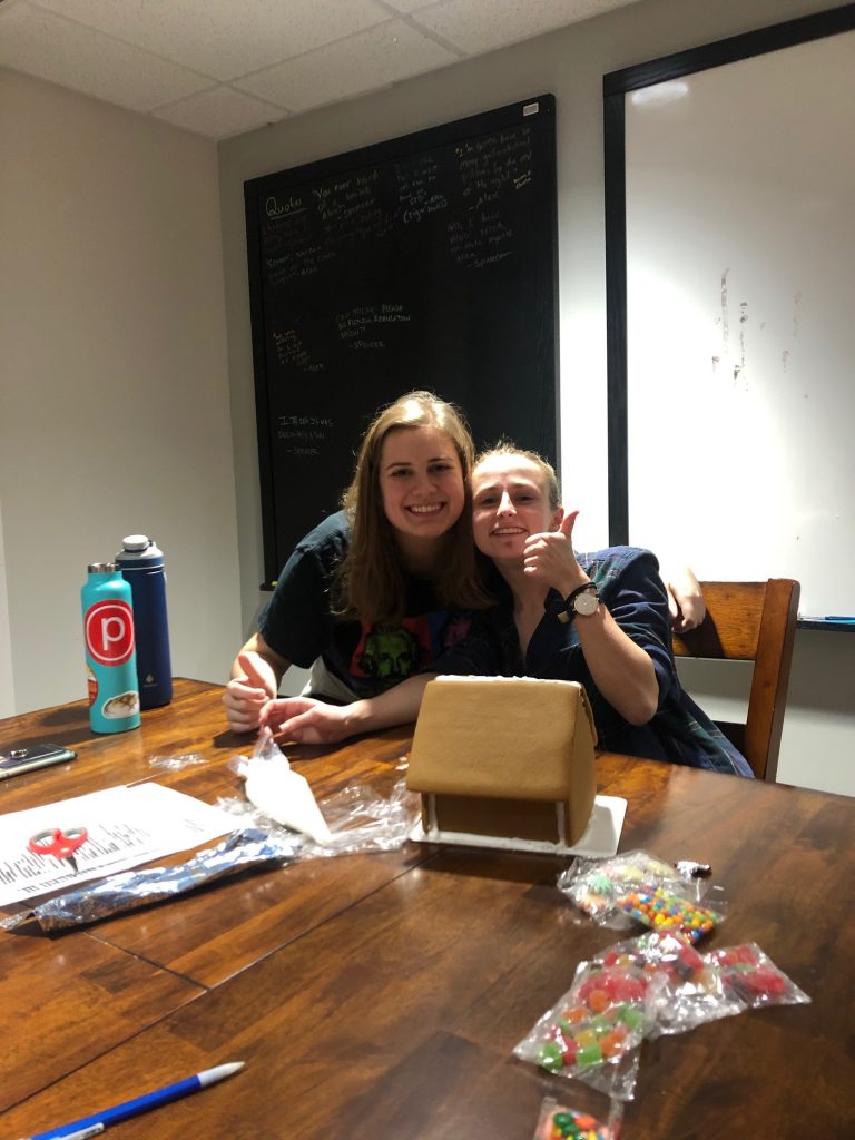 Olivia and Emily with their gingerbread house before it all fell apart